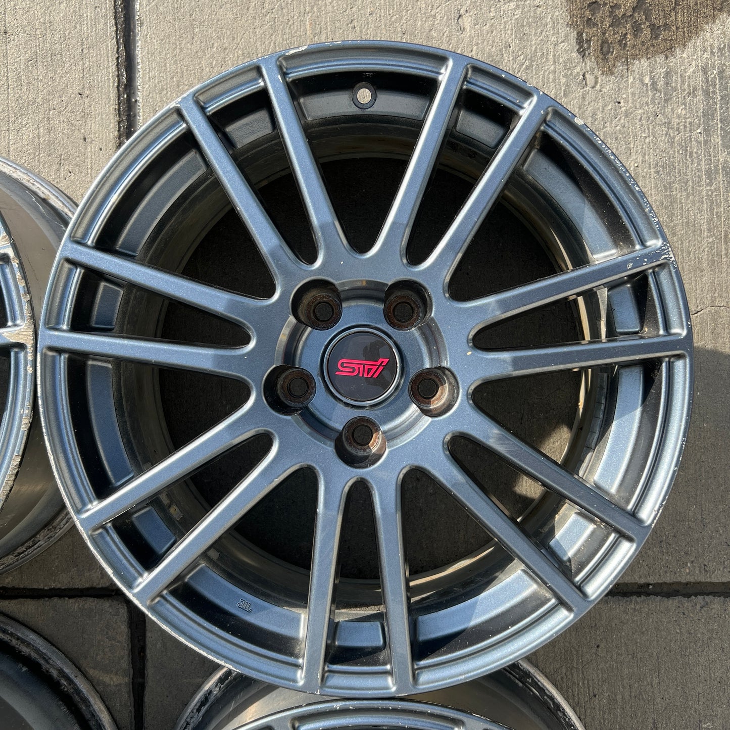 18” OEM Subaru STI Enkei flow-formed wheels